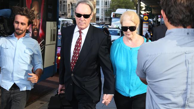 Former Hey Dad! actor Robert Hughes arrives at his trial with his actor agent wife Robyn Gardiner. Picture: Toby Zerna