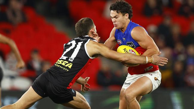 Cam Rayner breaks a tackle on his way to kicking four goals, including three in the final quarter. Picture: Daniel Pockett/AFL Photos/via Getty Images