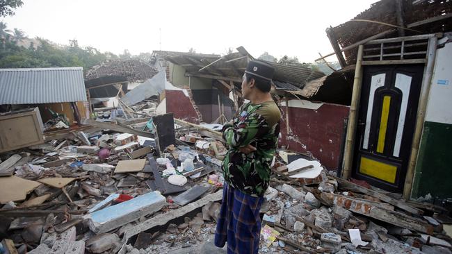 A man inspects the ruin of his house destroyed by Sunday’s earthquake in North Lombok. Picture: AP/Firdia Lisnawati