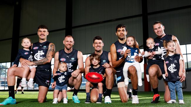 Zac Williams (with daughter Ayla), Sam Docherty (with daughter Ruby), George Hewett (with son Henry), Jack Martin (with daughter Rosie), Mitch McGovern (with son Hamish and daughter Margot). Picture: Dylan Burns/AFL Photos.