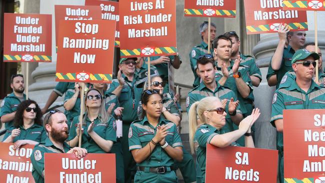 South Australian paramedics and firefighters along with supporters protest on the steps of Parliament House in Adelaide, SA. Picture: NCA NewsWire / Emma Brasier