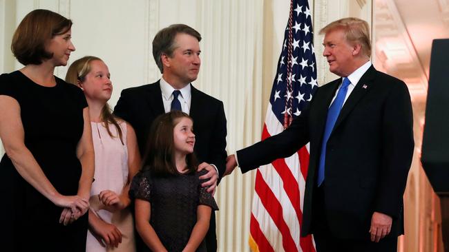 President Donald Trump, right, with Supreme Court nominee Brett Kavanaugh, his wife, Ashley, and their daughters at the White House yesterday. Picture: Reuters.