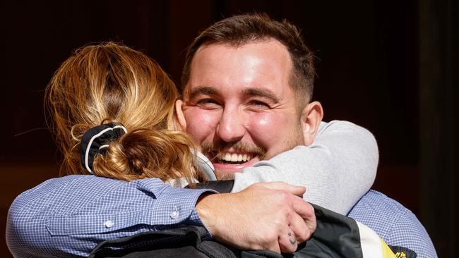 Hector Erdemsel celebrates with a supporter outside court. Picture: Russell Millard Photography