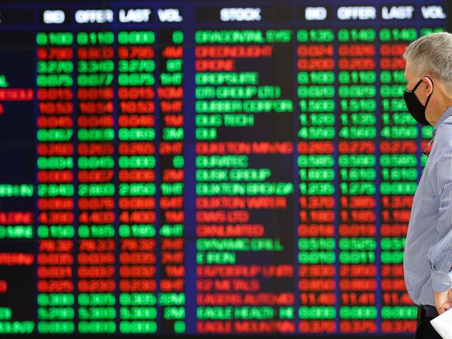 SYDNEY, AUSTRALIA - NewsWire Photos - NOVEMBER 11 2020: A man views the Stock Exchange boards in Sydney Australia. Picture: NCA NewsWire / Gaye Gerard