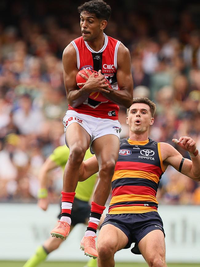 Nasiah Wanganeen-Milera marks in front of Crow Ben Keays at Adelaide Oval on Sunday. Picture: James Elsby/AFL Photos via Getty Images