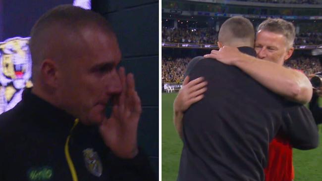 An emotional Dustin Martin leaves the MCG one last time / hugs former coach Damien Hardwick.