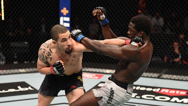 Robert Whittaker on his way to beating American Jared Cannonier at UFC 254. (Photo by Josh Hedges/Zuffa LLC via Getty Images)