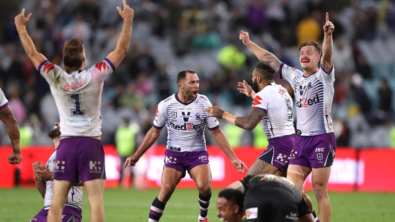 Melbourne Storm captain Cameron Smith celebrates with teammates after winning the NRL grand final. Picture: Mark Kolbe/Getty Images