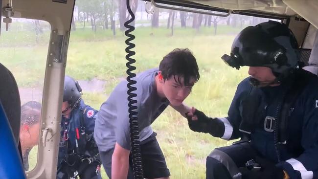 Sunshine Coast RACQ LifeFlight Rescue helicopter crew rescue a family of four who were stuck in floodwaters. Picture: RACQ Lifeflight Rescue