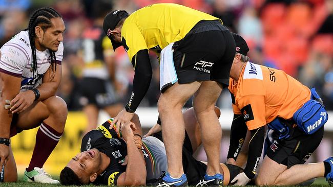 Viliame Kikau of the Panthers receives attention from trainers after sustaining an injury during the Round 16 NRL match between the Penrith Panthers and the Manly-Warringah Sea Eagles. Picture: AAP Image