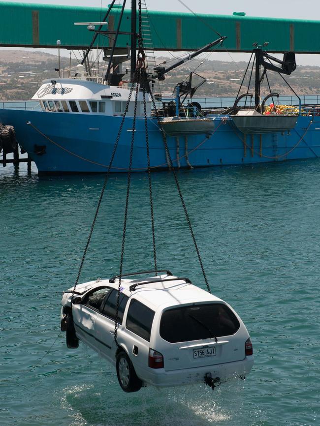 Damien Little’s Ford station wagon is lifted from the water. Picture: Ivon Perrin