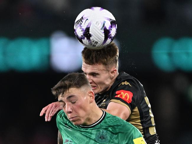 Benjamin Old heads the ball under pressure. Picture: Getty Images