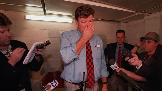 Neil Balme speaks to journalists after a game in 1997.