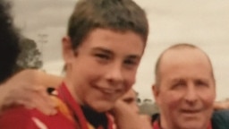 Rory Atkins with his dad Kenny after Maribyrnong Park won the under 14 premiership. Picture: Supplied.