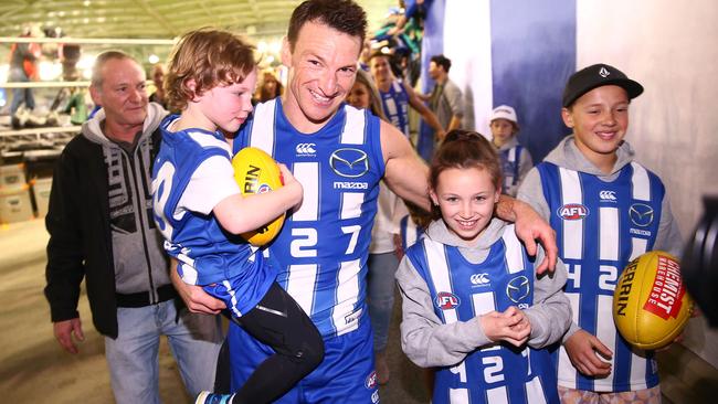 Brent Harvey with children (from left) Hudson, Lacie and Cooper and father Neil in the background.