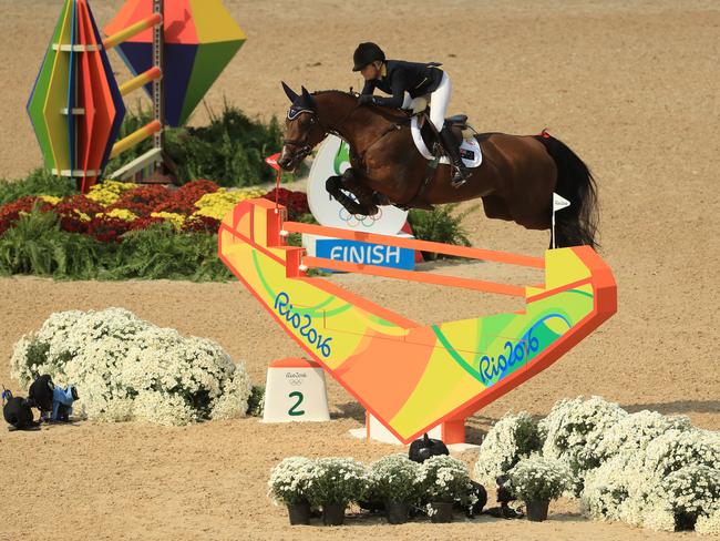 Edwina Tops-Alexander of Australia riding Lintea Tequila clears a barrier in the show jumping.