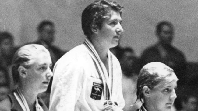 Three in a row: Dawn Fraser after receiving her gold medal for the 100m freestyle at the 1964 Olympic Games in Tokyo.