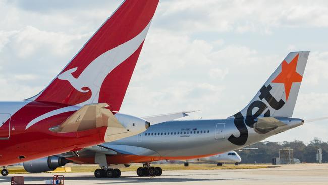 ESCAPE: Jetstar and Qantas aircraf tails. Picture: Jetstar