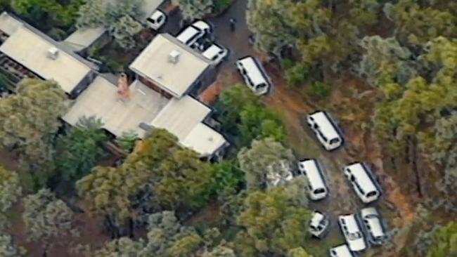 A Children of God facility in Melbourne in the 1990s is raided by police. Source: Channel 9