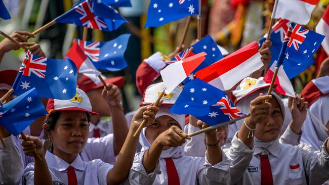 Children wave Indonesian and Australian flags during a welcome ceremony for Anthony Albanese and Indonesian President Prabowo Subianto at the Merdeka Palace in Jakarta last week. Picture: AFP