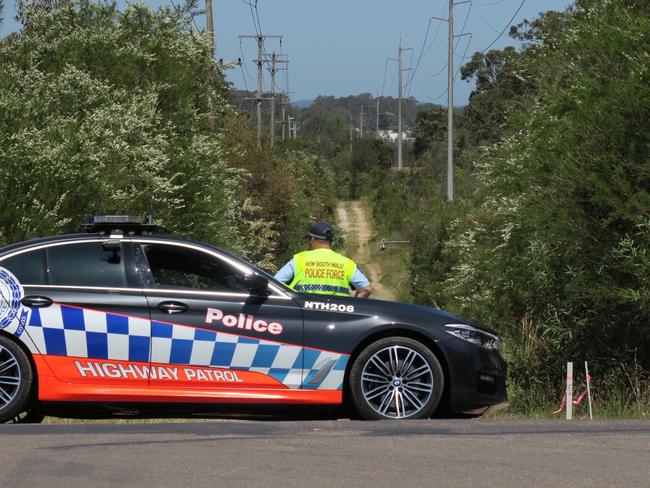 A Highway Patrol car blocks Virginia Rd Fire Trail at Hamlyn Terrace where York drove the stolen four-wheel drive in a bid to escape during the pursuit. Picture: NewsLocal