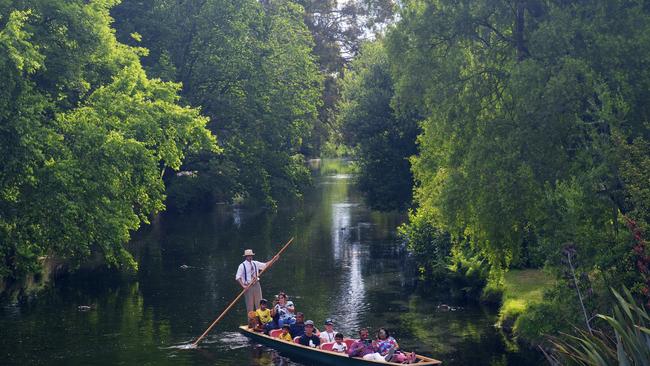 Tourists enjoying their Avon River Punting Tour in Christchurch Botanic Garden.