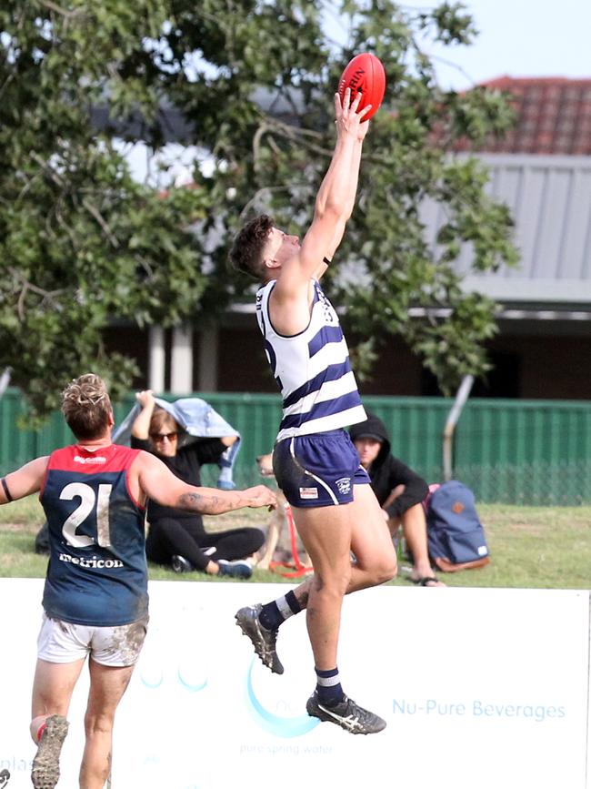 Ryan Pickering taking a mark for the Cats. Picture by Richard Gosling