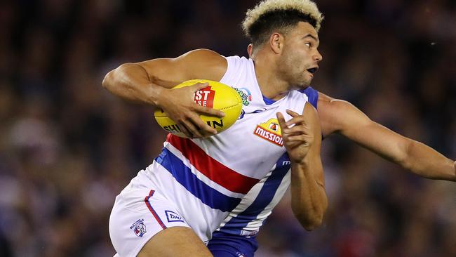 Jason Johannisen gives Kayne Turner the slip. Picture: Michael Klein