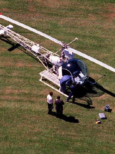 Detectives inspect the chopper that was used to break Killick out of prison.