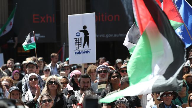 Tens of thousands of people backing the Palestinian cause gathered in Melbourne and Sydney, with a minority of protesters drawing reference to Adolf Hitler, Auschwitz and depicting the Star of David being thrown into a bin. Picture: David Crosling