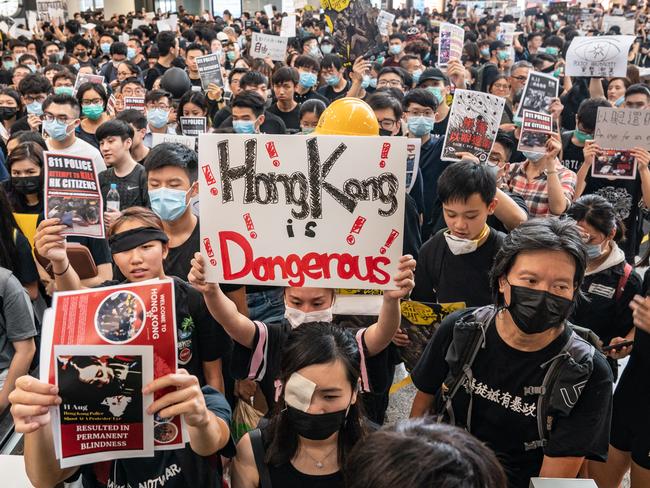 Protesters occupy the arrival hall of the Hong Kong International Airport. Picture: Getty Images