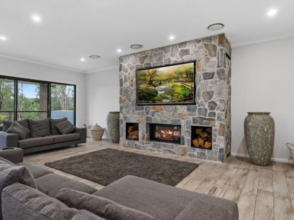 The fireplace – complete with TV nook.