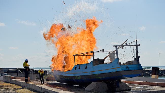 An illegal foreign fishing vessel caught in Australian waters in 2016 is set on fire.