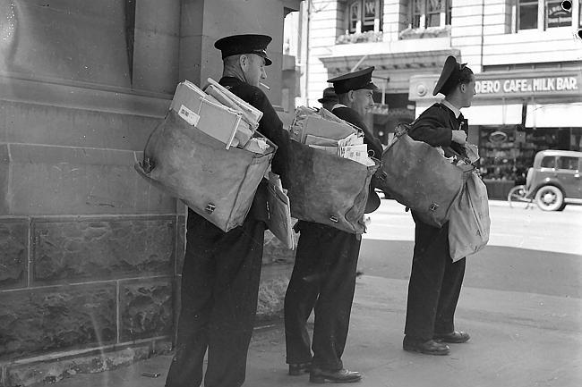 Postmen with their letter bags in Elizabeth Street, Hobart , in the 1930s.