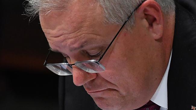 CANBERRA, AUSTRALIA - MARCH 23: Prime Minister Scott Morrison during Question Time in the House of Representatives at Parliament House on March 23, 2021 in Canberra, Australia. The federal government was yesterday set back by new allegationsÃÂ broadcastÃÂ by the Ten Network after pixelated images of unnamed Coalition advisers allegedly engaging in performing lewd sex acts on the desks of female MPs resulting in a Morrison staff member being sacked last night. Additionally, the ABC Network aired a first hand account by an Australian Parliament security guard of what she witnessed on the night Brittany Higgins was allegedly raped in the office of then-defence industry minister Linda Reynolds in early 2019. (Photo by Sam Mooy/Getty Images)