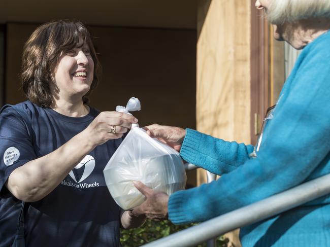 Volunteers play an important community role in delivering to homes for Meals on Wheels