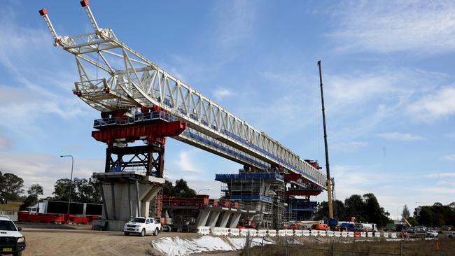 Crane over Windsor Rd for the Skytrain. Picture: Peter Kelly