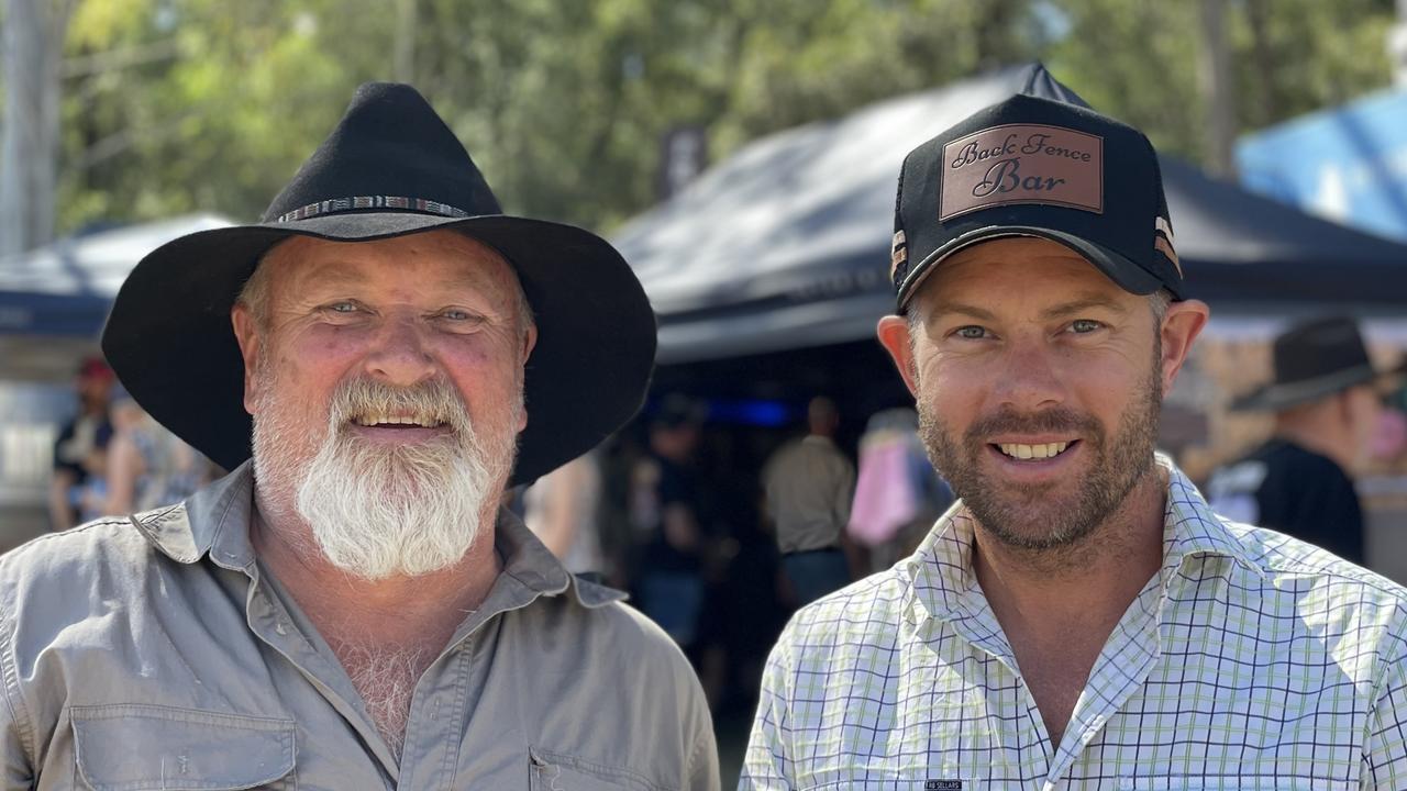 Tim McCarthy and Carlin Whittle, from Hervey Bay and running the Back Fence Bar to raise money for charity, enjoy day one of the 2024 Gympie Muster, at the Amamoor State Forest on August 22, 2024.