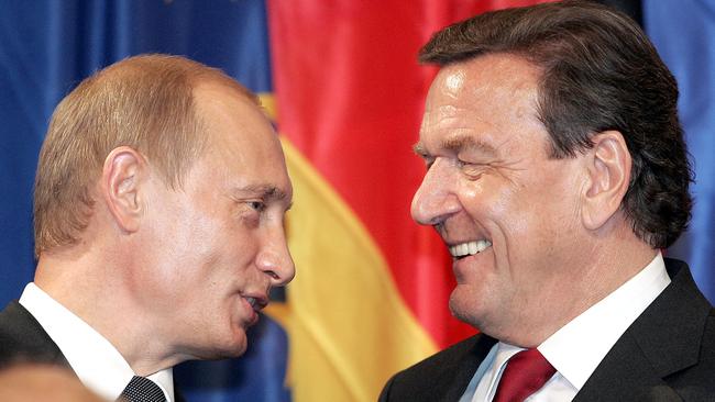 Then German chancellor Gerhard Schroeder, right, with Russian President Vladimir Putin after Russian energy giant Gazprom and German firms EON and BASF signed a deal to build the five-billion-dollar pipeline linking Russia and Germany. Picture: AFP