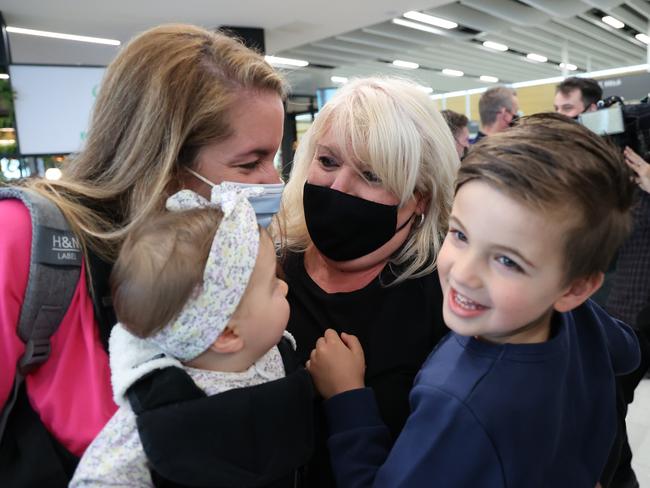 People reunite at Adelaide Airport on the first day of the border opening. Picture: NCA NewsWire / David Mariuz