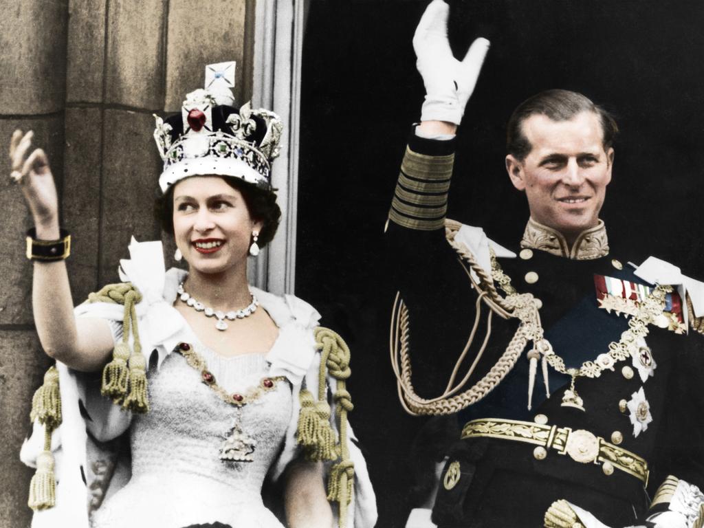 1953: A newly crowned Queen Elizabeth II and the Duke of Edinburgh on the day of the coronation at Buckingham Palace. Picture: The Print Collector/Getty Images