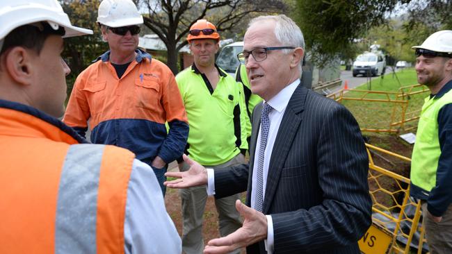 NBN rollout ... Federal Minister for Communications Malcolm Turnbull at Torrens Park, South Australia, talking to workers at the NBN rollout site. Picture: Campbell Brodie