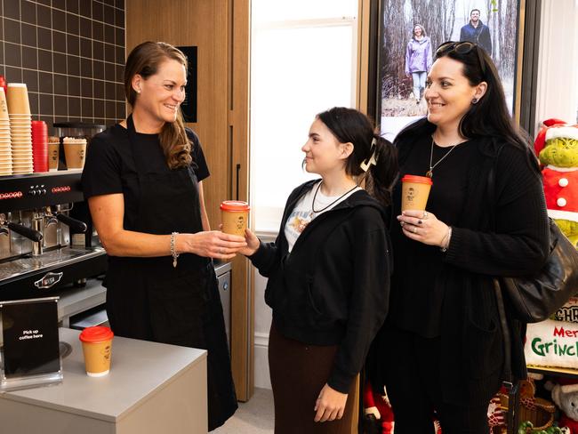 **EXCLUSIVE TO NETWORK** NO NEWS.COM.AU** An Australia Post barista making coffee for mother and daughter Vicky and Laura (12) at Australia Post's newly refurbished and designed community hub post office in Orange, NSW. Picture: Supplied