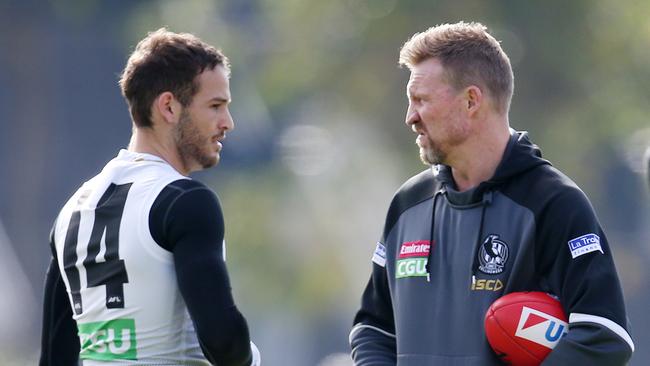 James Aish chats with Collingwood coach Nathan Buckley. Pic: Michael Klein.