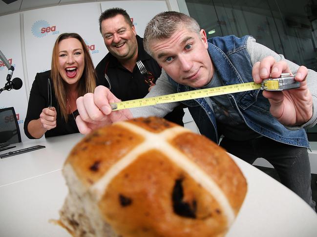 Cripps CEO Paul Gadonski, centre, with breakfast radio hosts Paul and Woody who have started a campaign to make the world's largest hot cross bun.