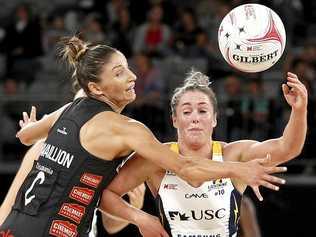 OUT OF SORTS: The Lightning were toppled by 14 goals by the Magpies in Melbourne. Laura Scherian passes the ball under pressure from Kim Ravaillion during round one of Super Netball. Picture: DANIEL POCKETT