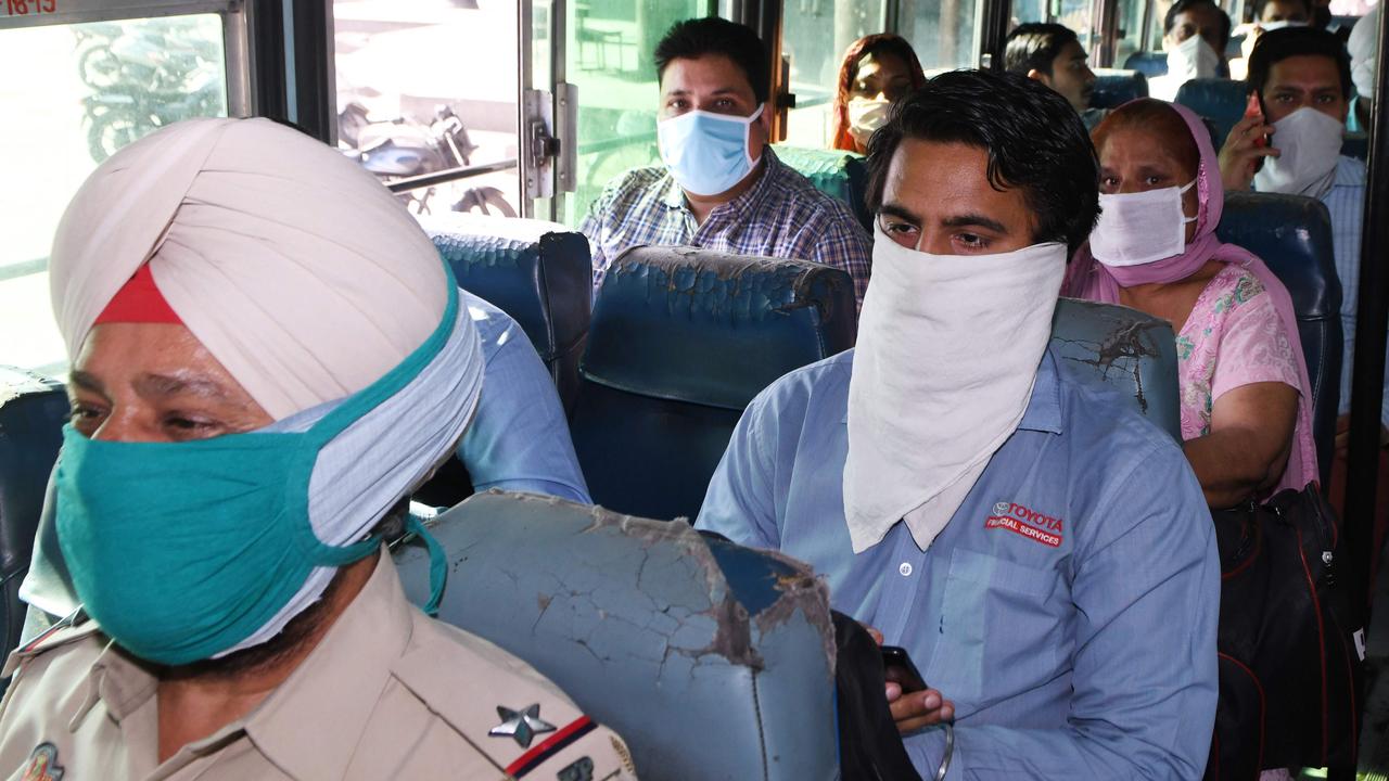 Passengers aboard a bus to Jalandhar. Picture: Narinder Nanu/AFP