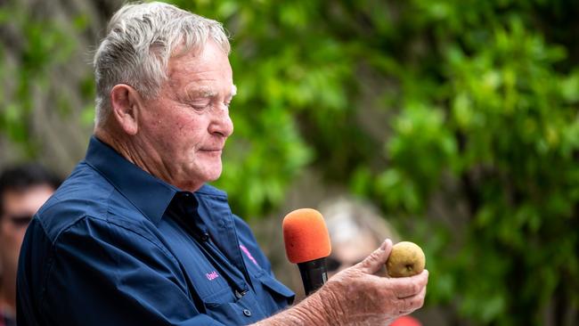 PROUD AS PUNCH: David Sutton, of Sutton's Juice Factory Cidery &amp; Cafe, with one of the apples grown on his farm (Image Leeroy Todd Photo and Film).