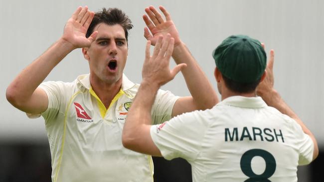 Australian captain Pat Cummins (left) and Mitch Marsh celebrate the wicket of England’s Zak Crawley on day one of the fifth Ashes Test at The Oval in London. Picture: AFP