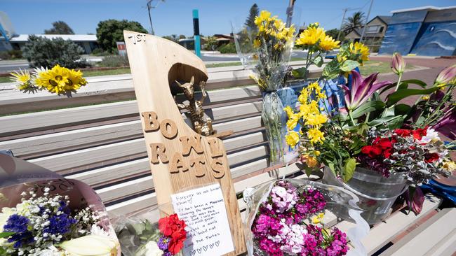 Flowers at a bench for Khai Cowley on the esplanade at Seaford Beach. Picture: Morgan Sette